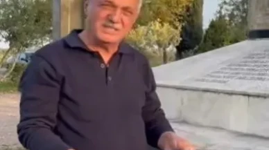 Sultanhisar Belediye Başkanı Osman Yıldırımkaya şehitliğe saygısızlık yapanlara çöpleri toplayarak tepki gösterdi