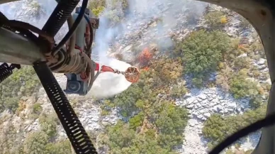 Muğla'nın Seydikemer ilçesinde makilik alanda çıkan yangın ormana sıçradı